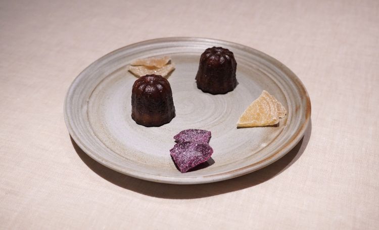 Petit fours: canelés, pickled and candied white, yellow and red turnips
