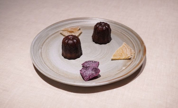 Petit fours: canelés, pickled and candied white, yellow and red turnips
