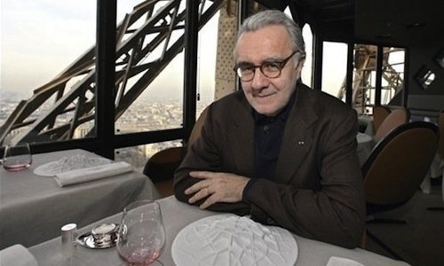 Alain Ducasse by the table in his Jules Verne rest