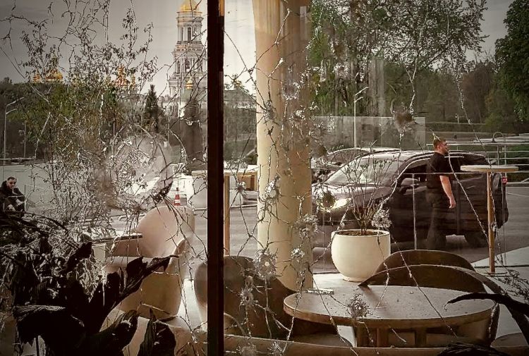 Shattered windows next to the dining tables at Ele