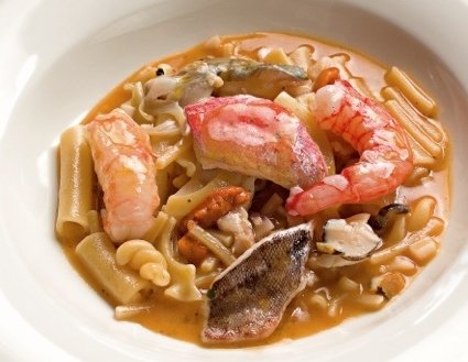Mixed pasta soup with small rockfish and crustaceans  