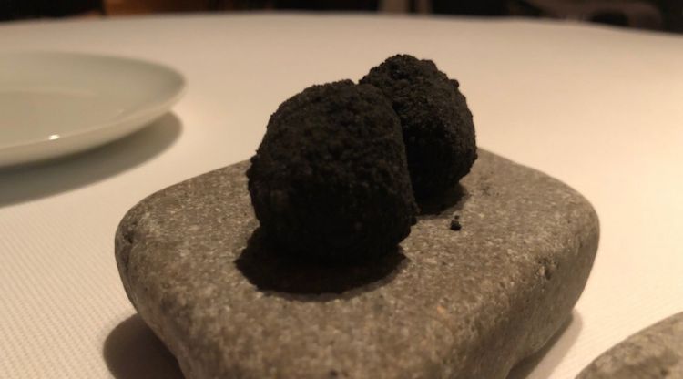 Amuse bouche: Fake DAM truffle with a heart of soft cheese and truffle flakes. The pairing with the amuse bouche:  Medot 48 Brut sparkling wine from the Slovenian Collio (60% Ribolla, 20% Pinot Noir, 20% Chardonnay) refined on the lees for 48 months (hence the name)
