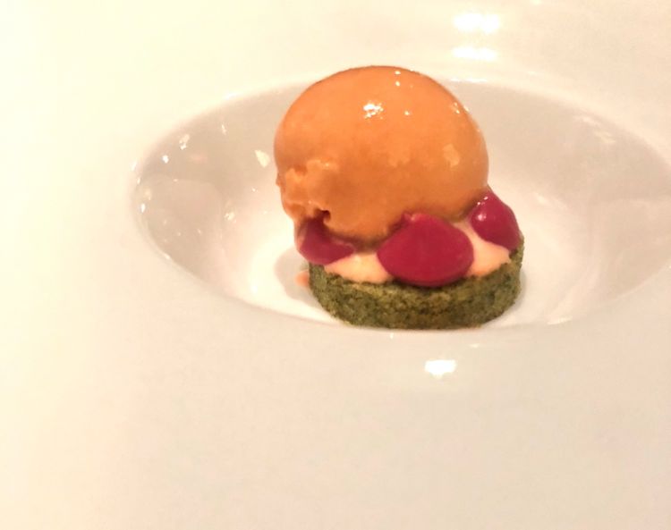 Pre-dessert: a shiso biscuit, enveloping red turnip cream and grapefruit-carrot sorbet. The acid-bitter-cold play and the deliciousness of the turnip cream prepare the palate for the dessert at the end
