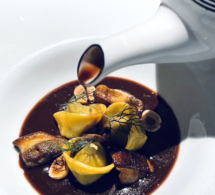 Andrea Antonini and Ravioli with rabbit liver, spugnole mushrooms and cocoa broth
