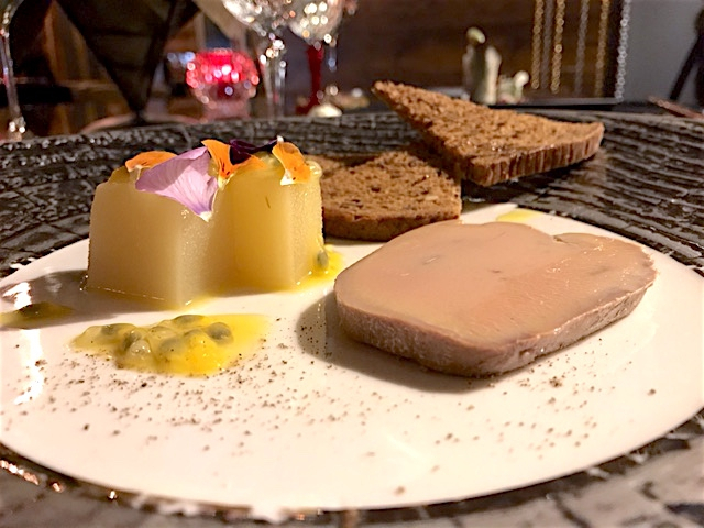 Goose foie gras terrine cooked in sweet salt from Cervia and marinated in extra virgin olive oil with gelatine of apples with passion fruit 
