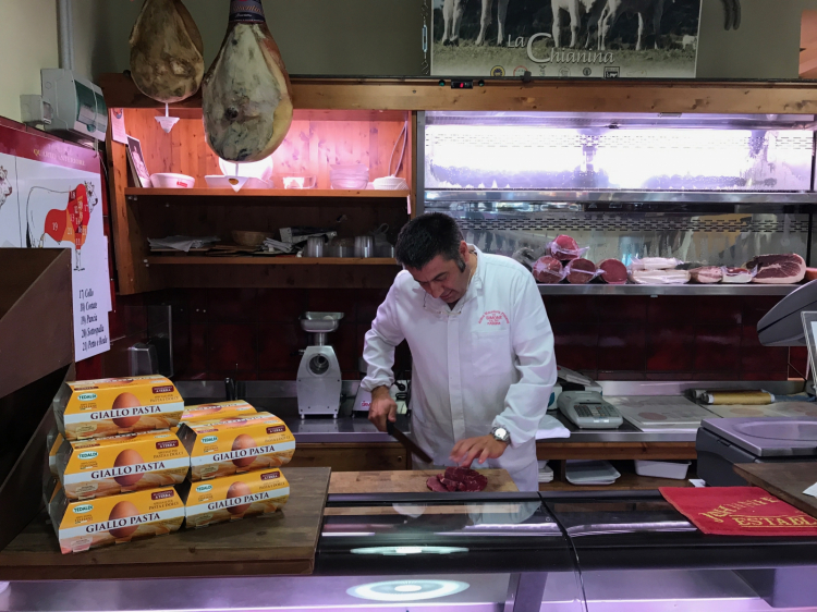 Fracassi at work in his butcher shop

