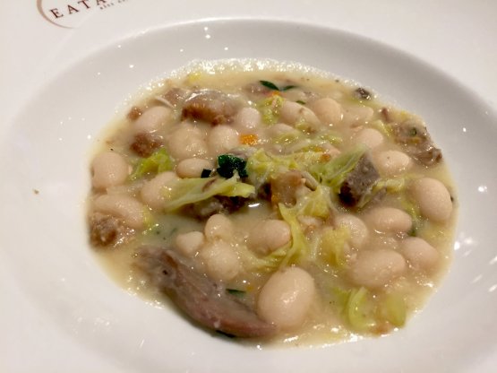 Soup with beans from Rotonda, pork cheek, Grana Padano and cabbage by Vito Mollica
