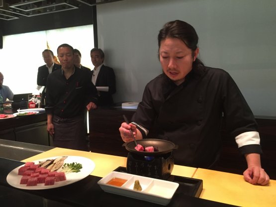 Chef Hide Shinohara of the Zero contemporary food in Milan, at work yesterday with wagyū beef