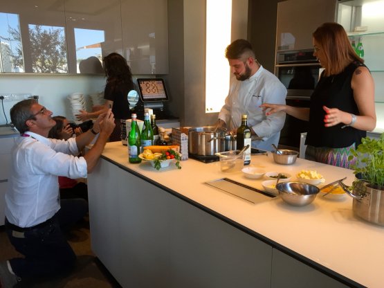 Riccardo Felicetti takes a picture of Colombo during the cooking demo