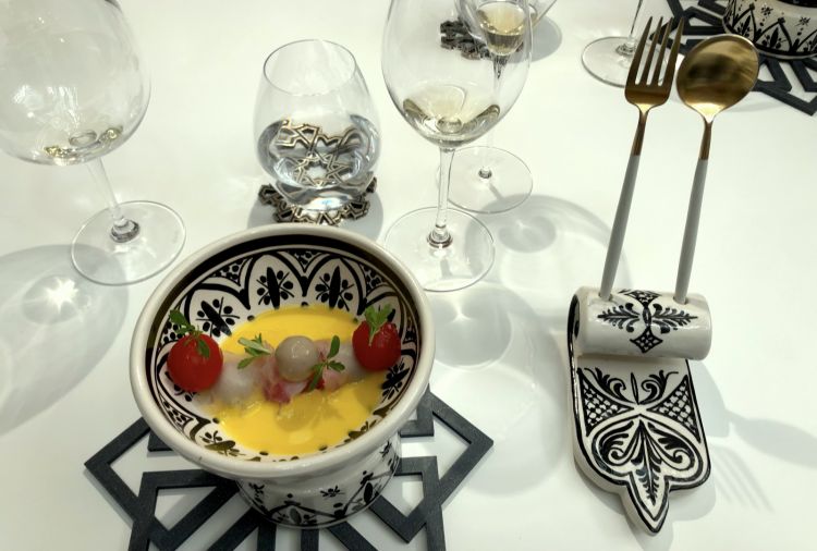 Andalusian mise en place. On the plate, Tomatoes, anchovies with pickled mandarin, monkfish in brine and tamarind