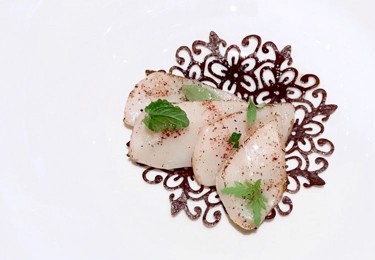 Scallops, dehydrated black currants, herbs and citrus fruits and emulsion of scallop roe 
