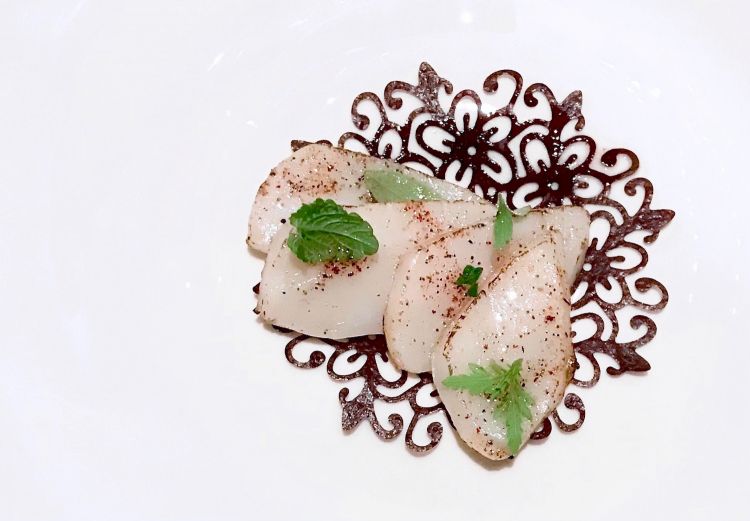 Scallops, dehydrated black currants, herbs and citrus fruits and emulsion of scallop roe 
