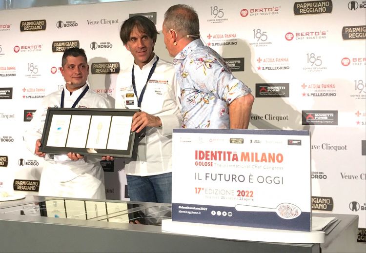 Handing the iconic Identità Milano plate to Davide Oldani
