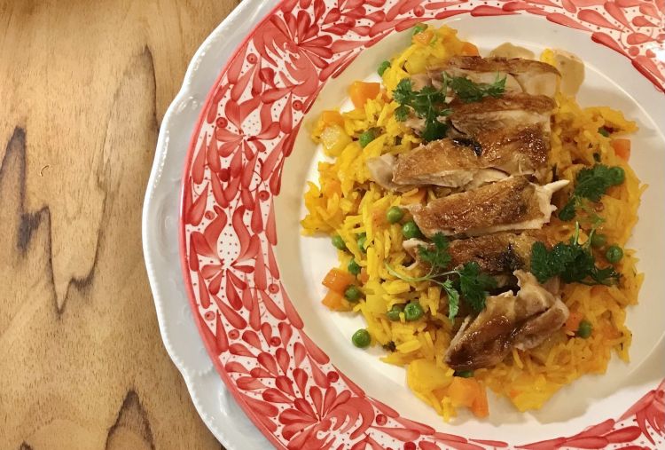 The Arroz chicken atollado is simple and delicious. Arroz atollado is a Colombian dish; on top of rice, it has chicken, pork, potatoes of different kinds, vegetables and seasonings
