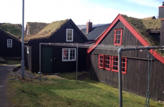 MINISTRIES WITH A CLOTHESHORSE. Two buildings, the location of two ministries, in Reyni, the ancient town of Tórshavn, Faroe’s capital