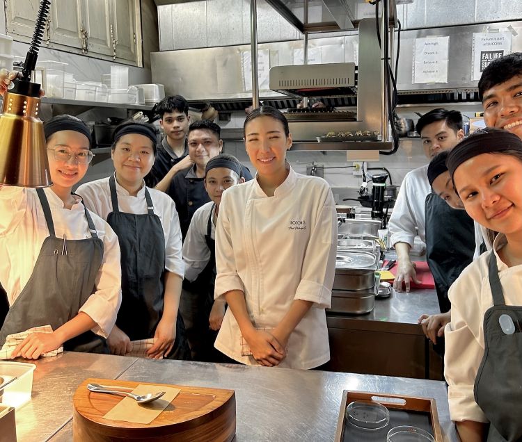Chef Pam in the kitchen with the brigade