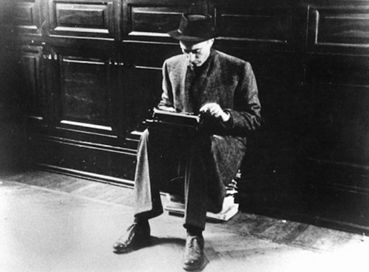 Indro Montanelli in the headquarters of Corriere della Sera in Via Solferino in Milan, or right after the war in Finland, in 1940 or back from the protests in Budapest in 1970. Fedele Toscani took this famous photo. On Montanelli's knees his Olivetti MP1, the first portable model from the producers in Ivrea
