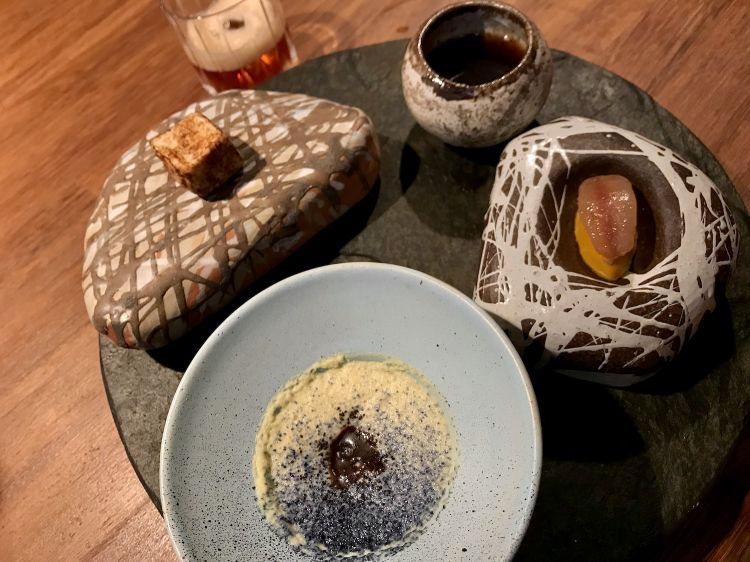 From the right, clockwise: Cucha, oil of mojojoy, creole saffron; Heart of palm, mojojoy, huito; Salted marshmallow of tail of Amazon caiman with palmito; Broth of ray fish, hormiga limonera and citrus herbs 
