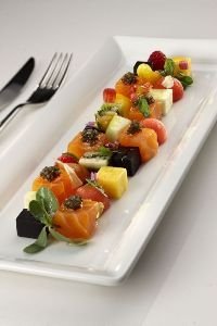 Vegetables and fruit mosaic with raw red prawns