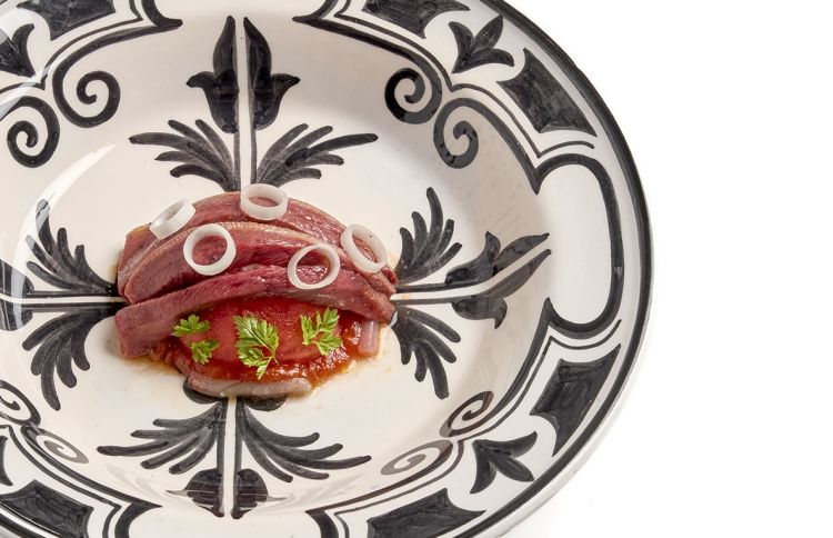 Insalata tiepida di piccione marinato al pomodoro