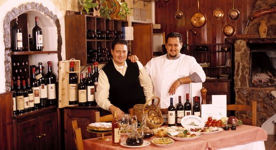 The two managers of restaurant La Pitraia, specialised in mushrooms and game