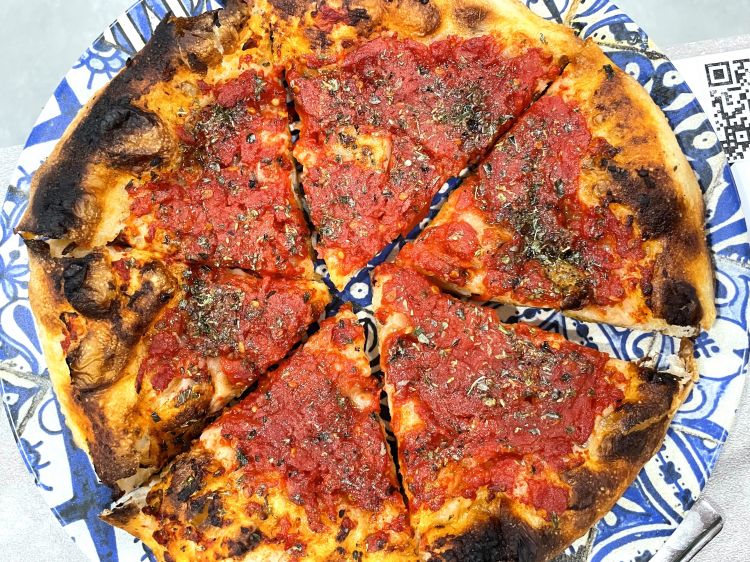 La pizza cotta "nel ruoto" a bocca di forno, lentamente