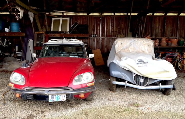 Under a canopy at Ayers Creek Farm, in Gaston, Oregon. Owner Anthony Boutard fixed two incredible Citroën models that made car history: a DS family car (to the left) and even a Traction Avant
