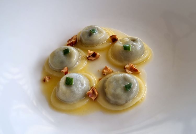 Potato ravioli with butter and sage, game finanziera and caramelised hazelnuts
