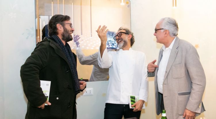 Carlo Cracco, Massimo Bottura and Alain Ducasse laughing
