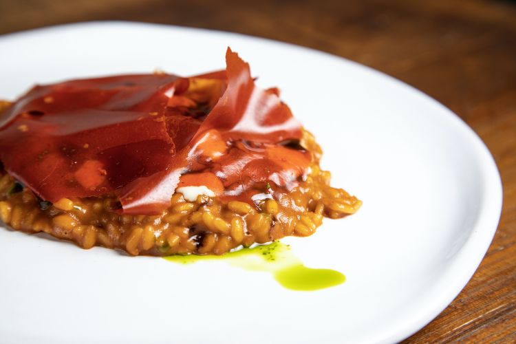 Risotto cotto in salsa di carapaci di gamberi e ossa di anatra
