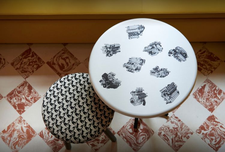 A mix of decorations: to the right, inspired by Fornasetti, to the left pied de poule hinting at the emblem of Ferrari
