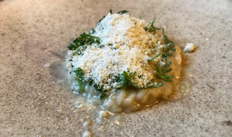 Risotto with charcoal oil, tagete and Sirius cheese
