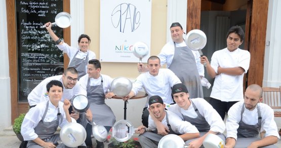 The kitchen staff of the first Spazio restaurant in Rivisondoli (L'Aquila), in the previous location of restaurant Reale