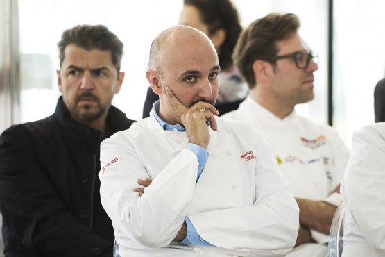 A close-up photo of Andrea Ribaldone during the presentation of the Identità Expo S.Pellegrino programme. In the background, Andrea Berton and Renato Bosco, two among the many chefs who will participate in our space (photo credits Brambilla / Serrani) 
