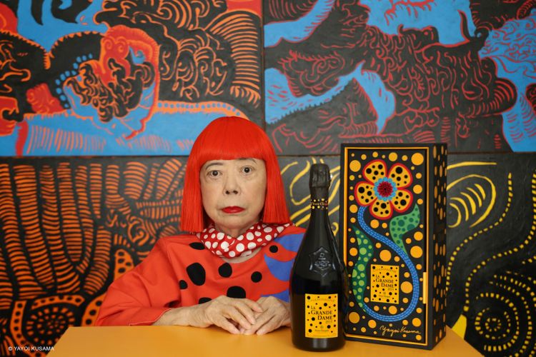 A portrait of Yayoi Kusama with the new bottle of Grande Dame 2021
