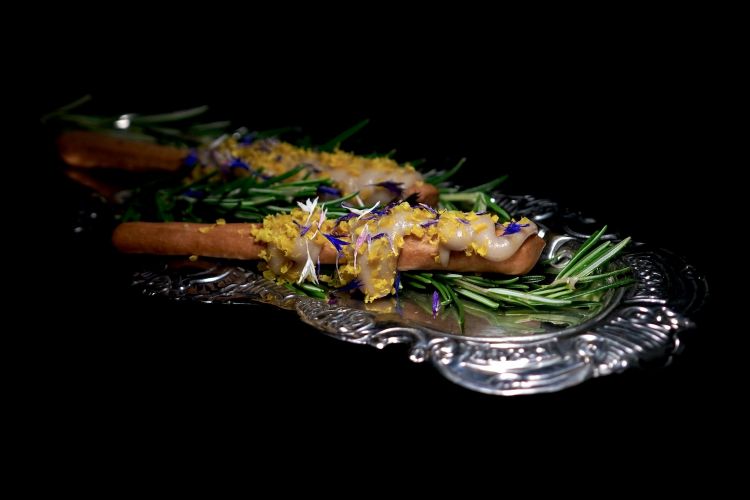 Maison multigrain breadsticks with anchovy cream and grated egg yolk