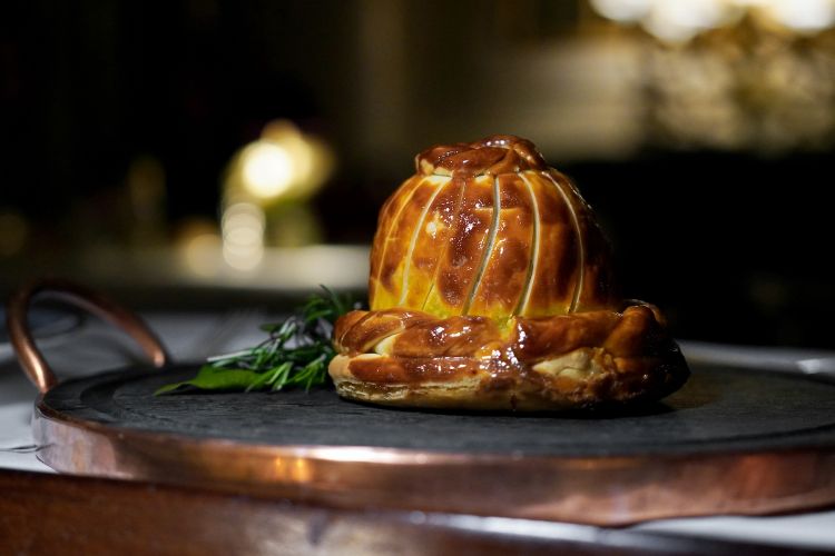 Lamb pithivier stuffed with foie gras, savoy cabbage and quince in syrup