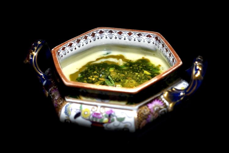 Mixed pasta, potatoes, pecorino, parmesan, pistachio and mint in the soup bowl