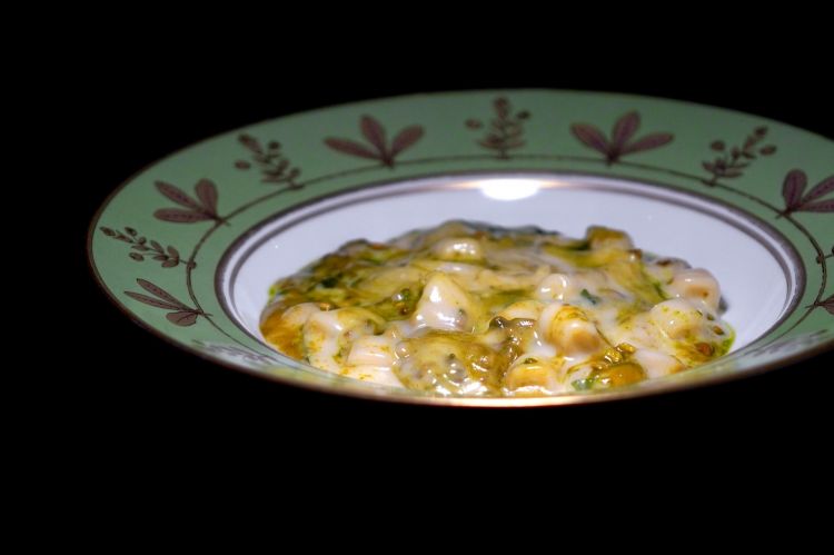 Mixed pasta, potatoes, pecorino, parmesan, pistachio and mint on the plate