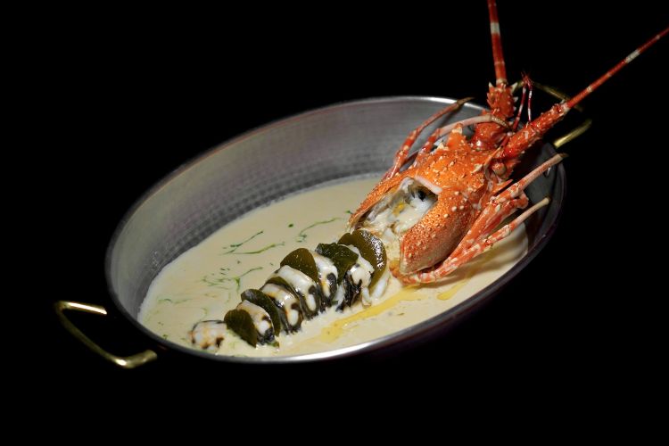 Lobster cooked in butter at 62°C for 25 minutes, sauce with Marsala De Bartoli and tarragon extract, caper leaves, pumpkin puree. All pictures are by Tanio Liotta